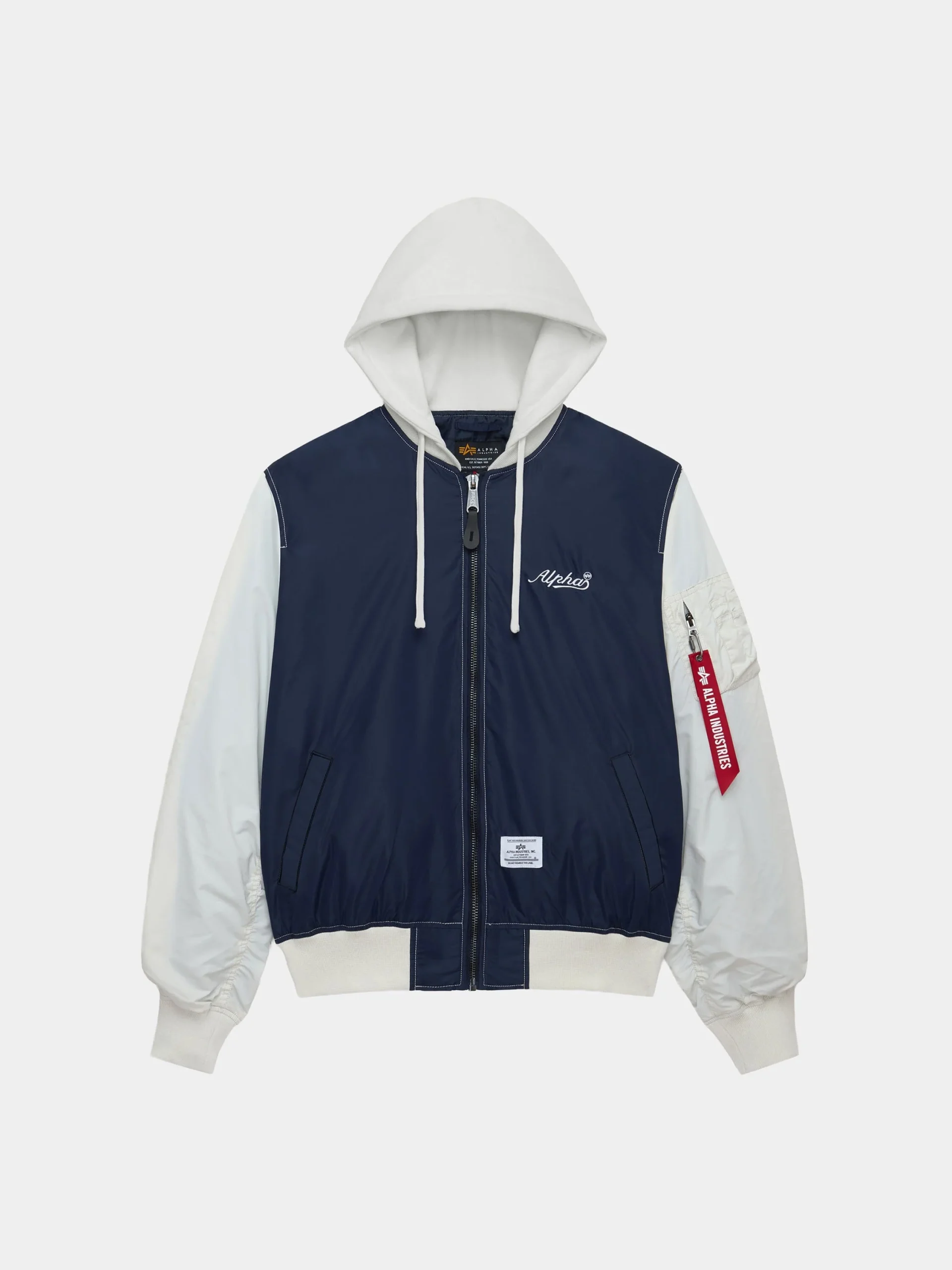 Lightweight Alpha Industries L-2B relaxed varsity flight jacket in navy and off-white, featuring a zip-front nylon body, contrasting sleeves, attached hood with drawstrings, ribbed hem and cuffs, angled hand pockets, and signature red “Remove Before Flight” sleeve tag