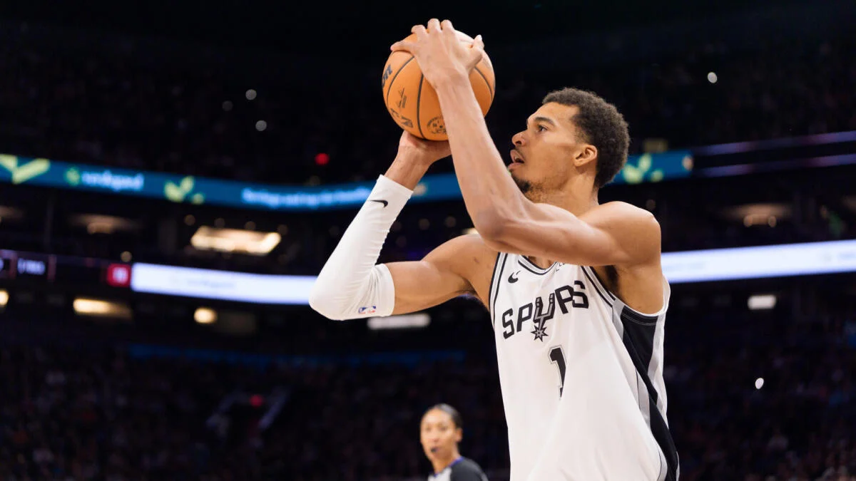 Victor Wembanyama of the San Antonio Spurs prepares to shoot a free throw during an NBA game, focused under arena lighting