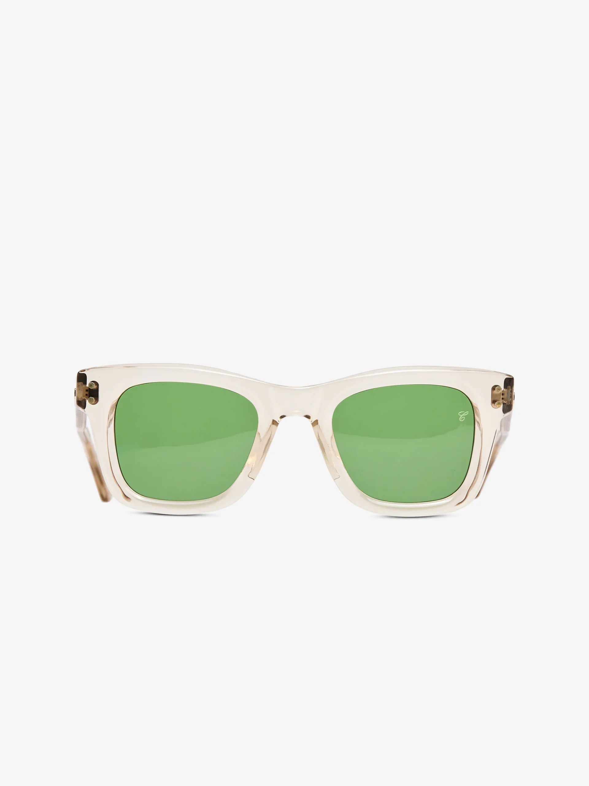 Transparent acetate square-frame sunglasses with soft champagne tint, green lenses, and exposed gold-tone hinges, front-facing minimal design with subtle logo detail on lens