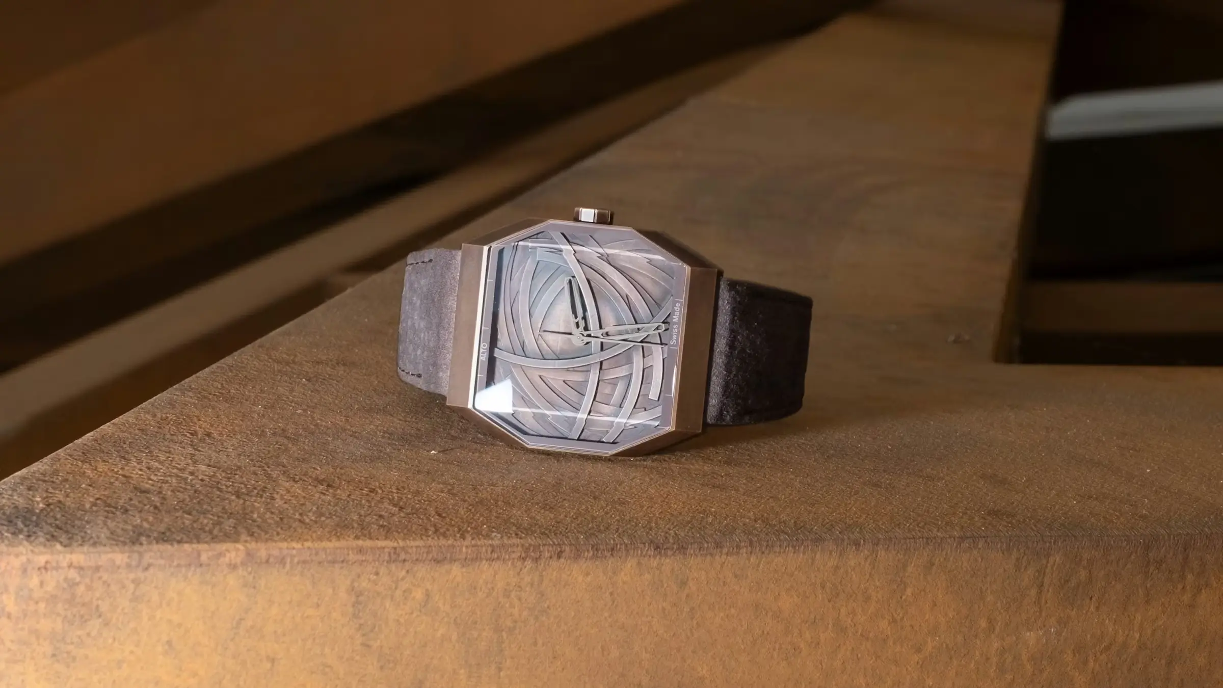 Alto Art 01 watch with angular case and sculptural dial resting on a textured surface