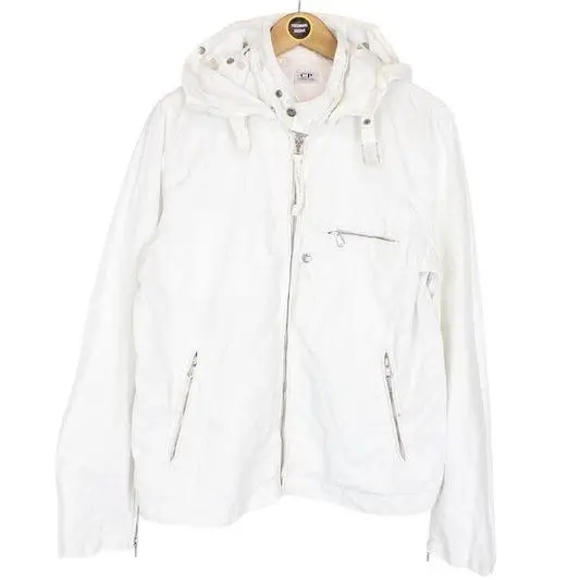 White C.P. Company hooded jacket featuring a lightweight cloth fabric shell, full zip front with snap fastening, adjustable drawstring hood, angled zip hand pockets, and a chest zip pocket in a clean, minimal technical silhouette