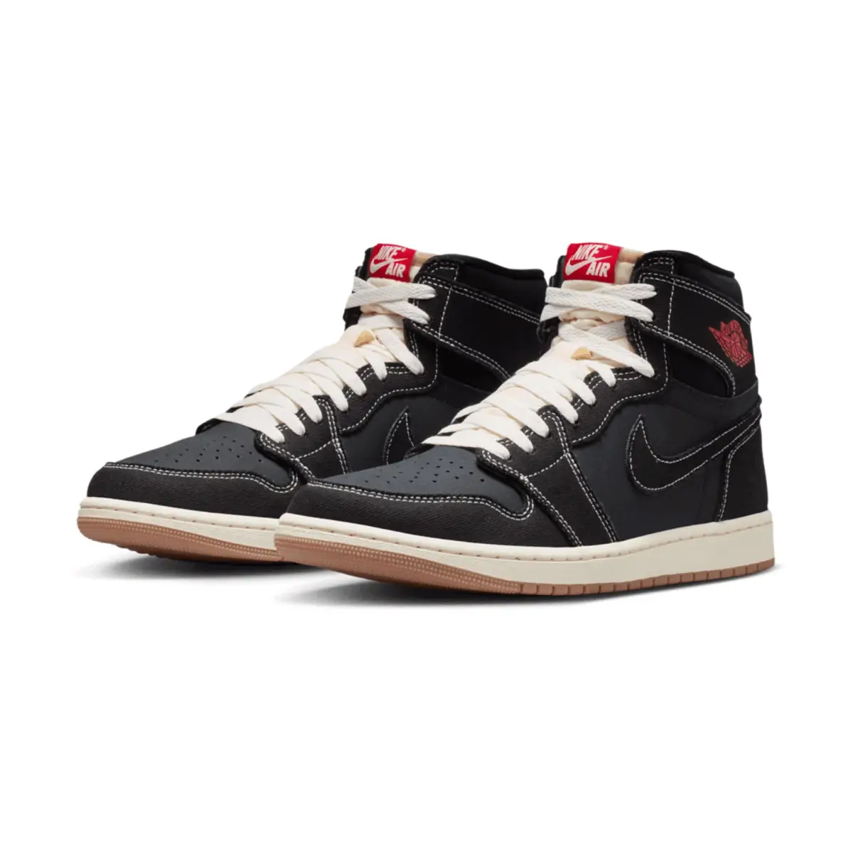 Three-quarter view of the Air Jordan 1 High OG “Flight Club” (2026) pair in black leather with white contrast stitching, white laces, red Nike Air tongue tags, red Wings logos, Sail midsole, and gum outsole on a clean studio background