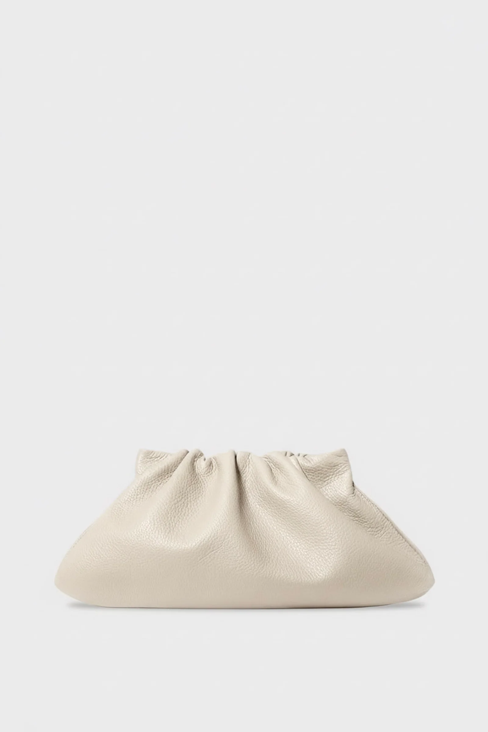 Softly gathered A–Esque Midi Cloud Bag in Grain White Wash leather, featuring a sculptural pouch silhouette with subtle pebble texture and a warm off-white tone against a minimal background