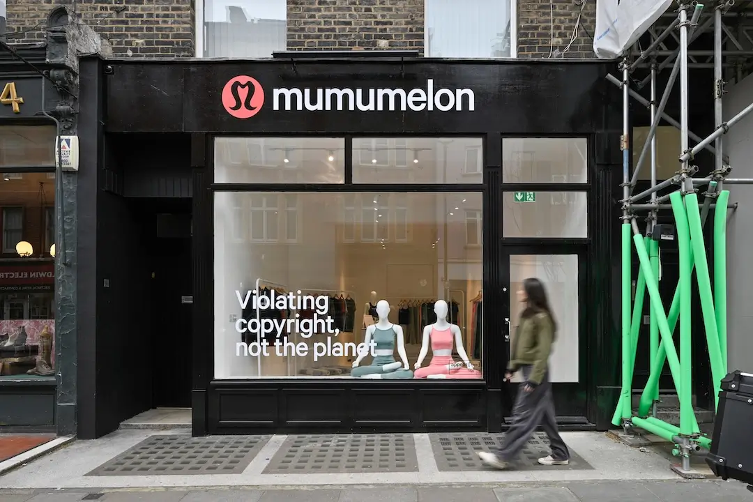 Mumumelon London pop-up store exterior with mannequins and window text “Violating copyright, not the planet,” showcasing climate-focused fashion parody installation