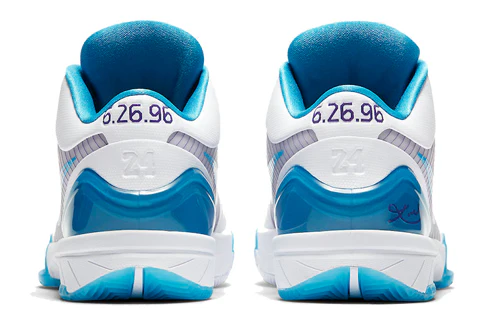 Rear view of the Nike Kobe 4 “Draft Day” shoe showing teal and white heels, with “6.26.96” embroidered on each side, Kobe’s number 24 molded into the heel, and his signature detail near the outsole