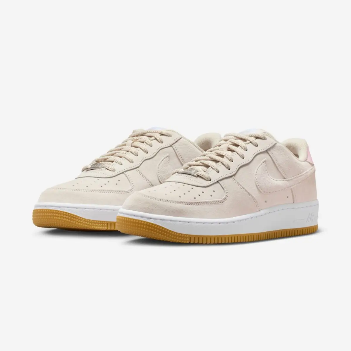 Angled side view of the Nike SB x Air Force 1 Low “Light Orewood Brown,” featuring a tonal beige suede upper, textured Swoosh, perforated toe box, white midsole, and gum rubber outsole